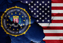 FBI seal superimposed on cracked American flag.