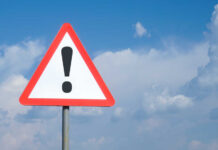 Triangular warning sign with exclamation mark