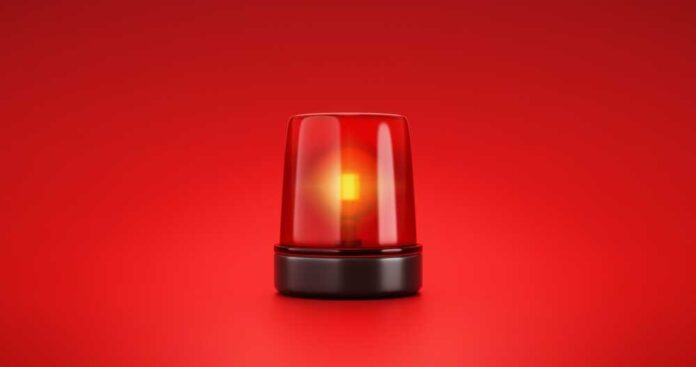 shutterstock_2053758056.jpg featured image Red emergency light on red background