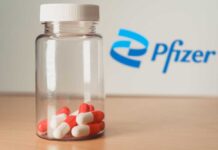 Pfizer bottle with red and white capsules