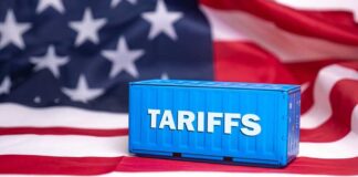 Shipping container reading tariffs on the American flag
