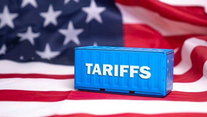 shutterstock_2593025849.jpg featured image Shipping container reading tariffs on the American flag