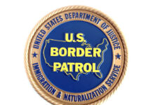 U.S. Border Patrol emblem with Department of Justice insignia.