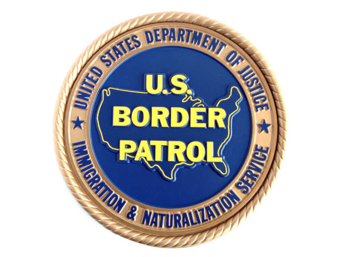shutterstock_36533647.jpg featured image U.S. Border Patrol emblem with Department of Justice insignia.