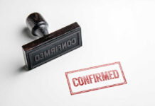 Rubber stamp with red confirmed imprint