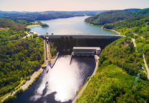 Aerial view of a large dam and reservoir