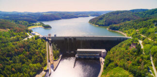 Aerial view of a large dam and reservoir