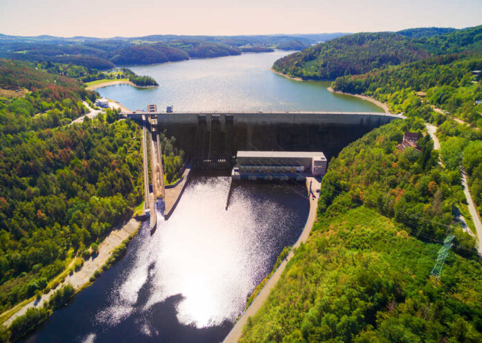 Aerial view of a large dam and reservoir