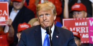 Donald Trump at a rally with supporters.