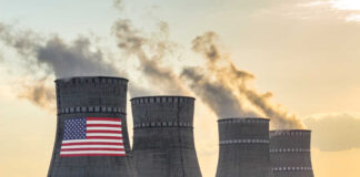 Cooling towers with USA flag and smoke clouds
