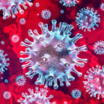Microscopic view of coronavirus on a red background.