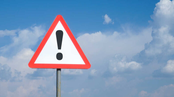 Triangular warning sign with exclamation mark