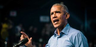Barack Obama speaks at podium.