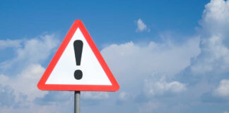 Triangular warning sign with exclamation mark