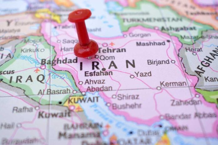 shutterstock_2237379503.jpg featured image Red pushpin on map of Iran