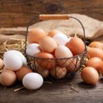 Waffle House Announces Egg-cellent News! Brown and white eggs in a wire basket.