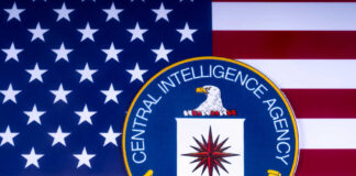 CIA emblem on American flag background.