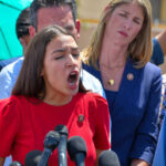 Tip TAX RAGE: Ocasio-Cortez Sounds Alarm! (Video) Alexandria Ocasio-Cortez speaking passionately at microphones.