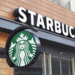 Starbucks’ Early PSL Gamble – Good or Bad? Starbucks cafe exterior with logo and sign