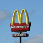 McDonald’s drivethru sign against a blue sky