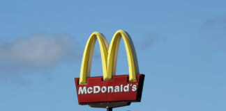 McDonald’s drivethru sign against a blue sky