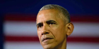 Barack Obama in front of flag