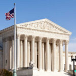 Transgender ATHLETE BANS: SUPREME COURT Showdown U.S. Supreme Court building with American flag.