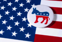 Democratic donkey button on American flag background