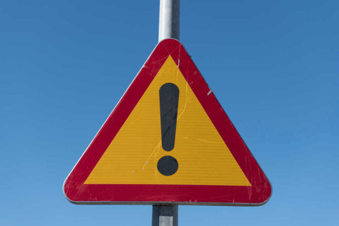 Triangular warning sign with exclamation mark
