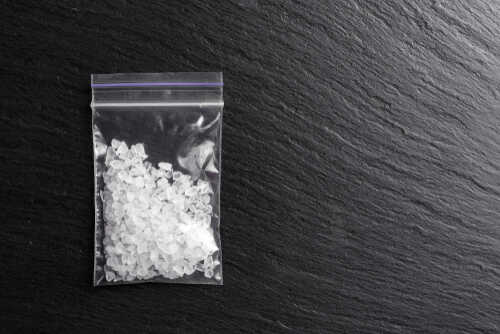 A clear ziplock bag filled with crystal meth