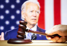 Joe Biden with a hand holding a gavel