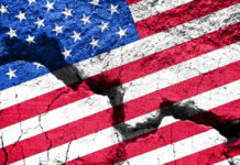 Cracked United States flag on textured surface