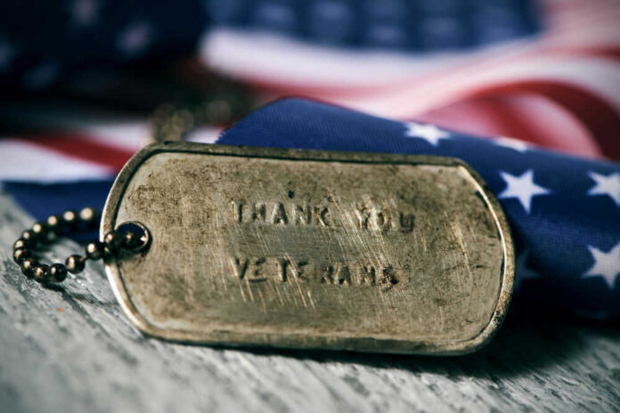 Dog tag and American flag honoring veterans