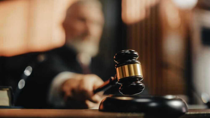 Judge striking gavel in courtroom