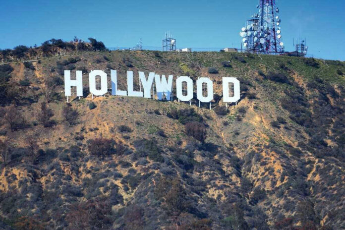Hollywood sign on hillside with communication towers