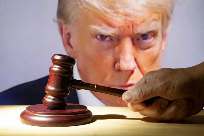 Gavel in front of Donald Trumps face on screen.