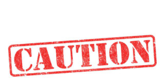 Red caution sign with grunge texture diagonal