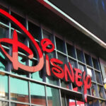 Disney sign on building with Mickey Mouse figure