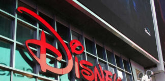 Disney sign on building with Mickey Mouse figure