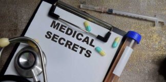 Medical documents with a stethoscope, pills, and a test tube