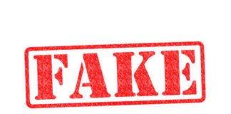 Red stamp with the word FAKE prominently displayed