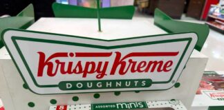 Krispy Kreme doughnuts in a display box with assorted flavors