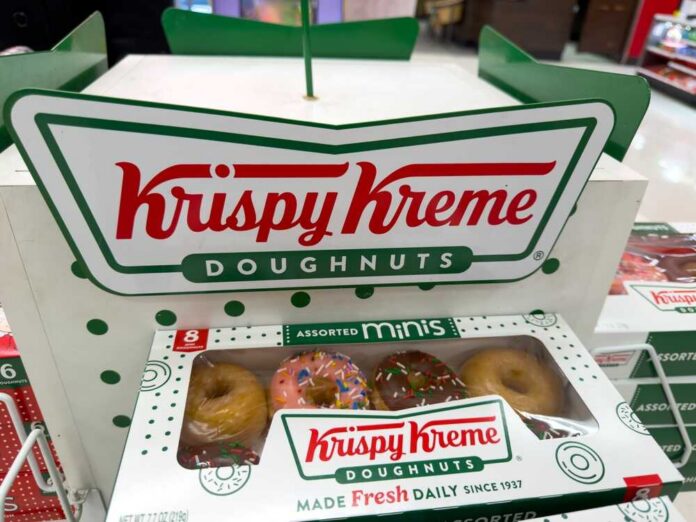 Krispy Kreme doughnuts in a display box with assorted flavors