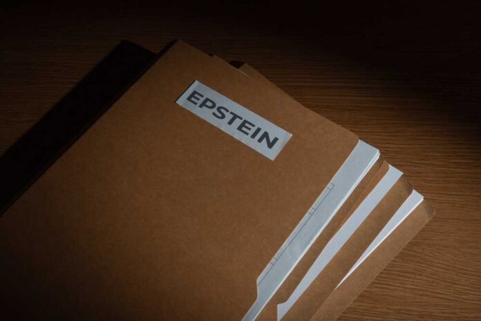 Stack of brown file folders labeled 'EPSTEIN'