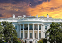 Ballroom Battle: Trump’s Project Survives Challenge The White House with vibrant sunset sky.