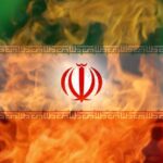 Iranian flag with flames in the background