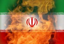 Iranian flag with flames in the background