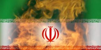Iranian flag with flames in the background