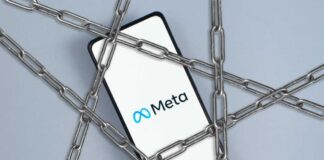 A smartphone displaying the Meta logo surrounded by chains
