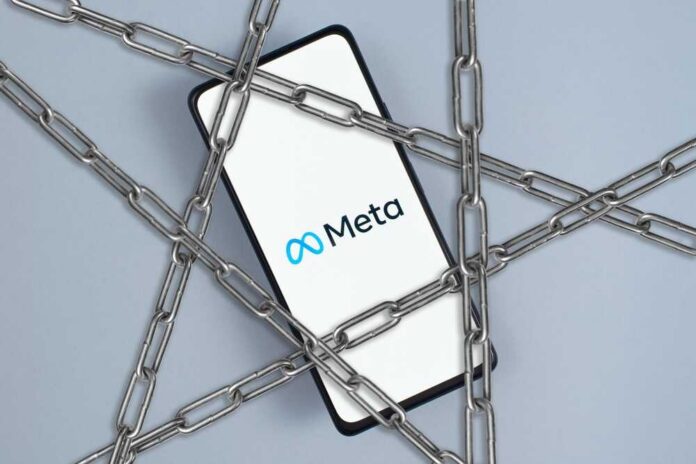 A smartphone displaying the Meta logo surrounded by chains